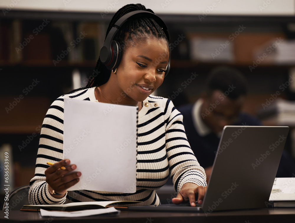 Woman, studying and headphones in library for research, documents and computer research or planning 