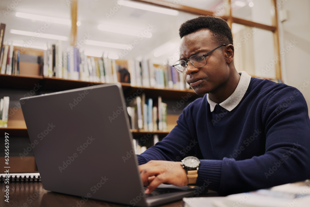 Student, frustrated and black man typing on a laptop in university or college campus angry due to as