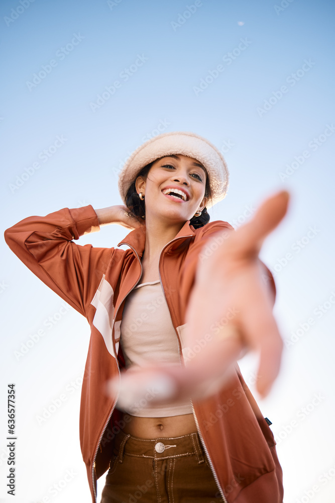 Portrait, woman smile and offer helping hand to welcome outdoor on low angle mockup space. Happy, pa