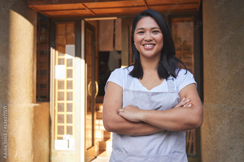 Portrait, waitress and Asian woman with arms crossed at restaurant, coffee shop or store. Face, smil