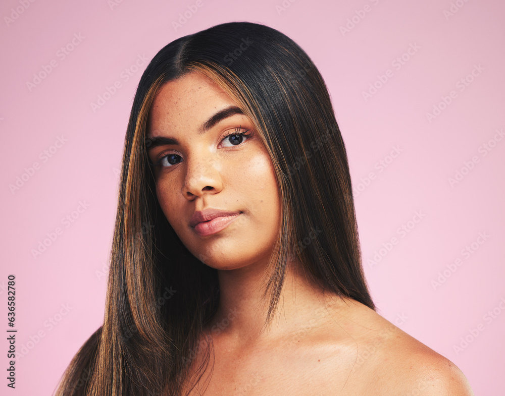 Portrait, hair care and woman with cosmetics, growth and skincare on a pink studio background. Face,