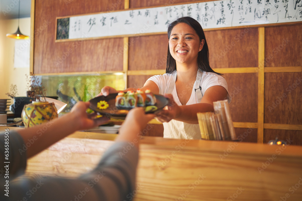 Sushi chef, restaurant worker and woman with smile from food and Asian meal in a kitchen. Happy, fem