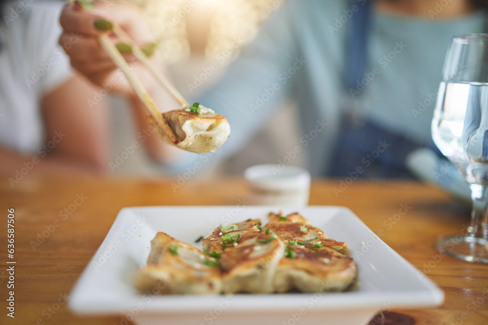 Table, plate and chopsticks with a dumpling at a restaurant for food, Asian culture or fine dining. 