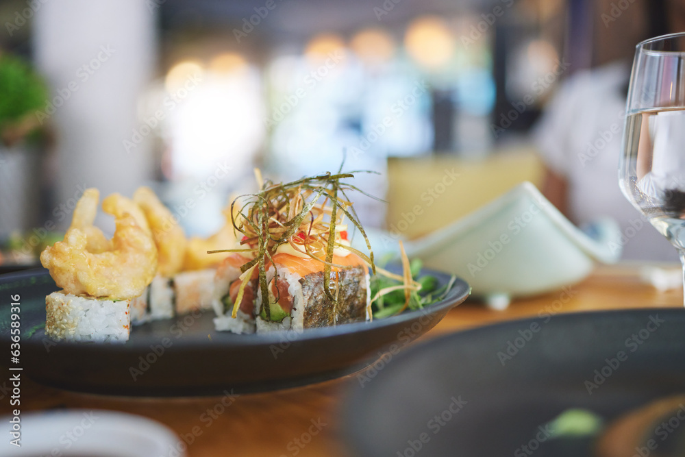 Sushi restaurant, catering and seafood in closeup for service, brunch or dinner with wine, glass and