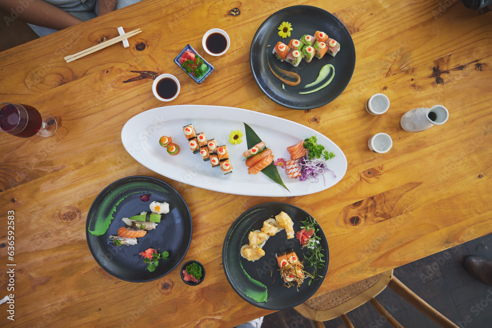 Sushi, seafood and chopsticks in an asian restaurant from above for fine dining or traditional cuisi