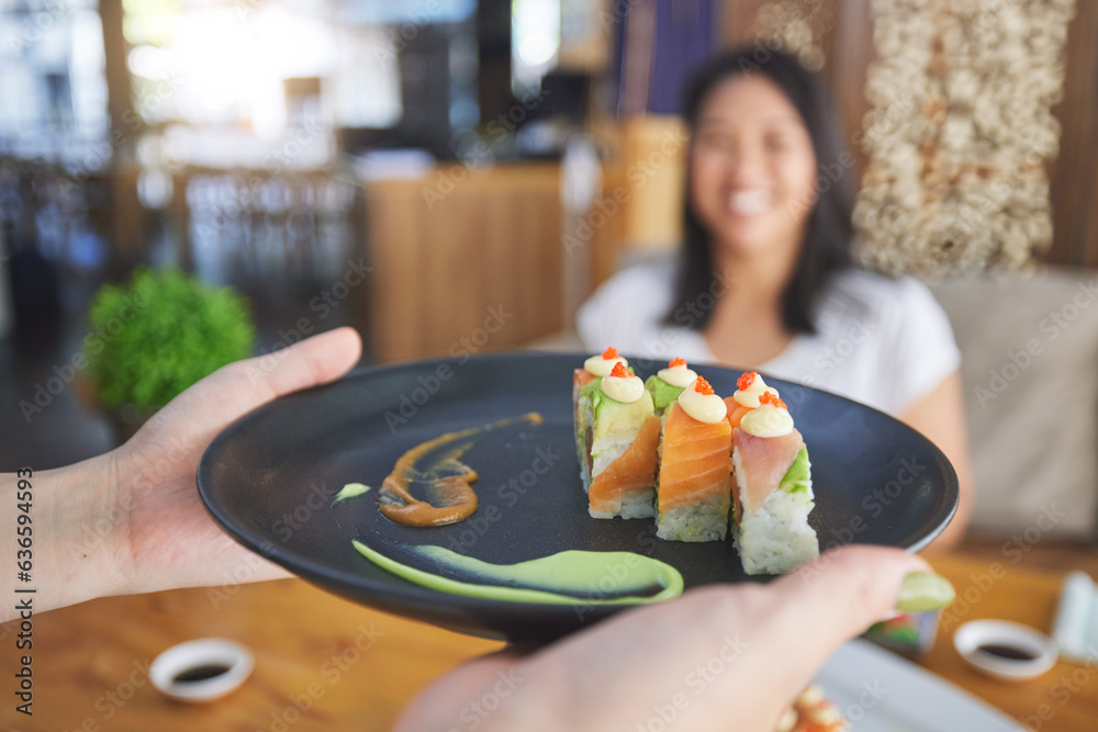 Sushi restaurant, people and waiter hands serving food plate, order or fish product for diner, cafet