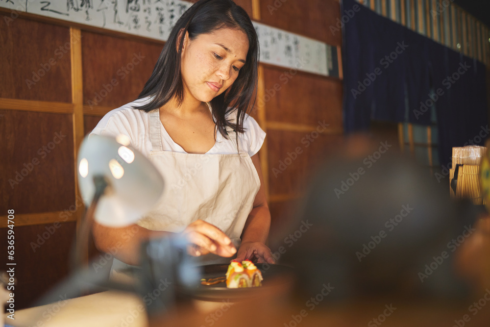 Chinese food, recipe and an asian woman in a sushi restaurant to serve a traditional meal for nutrit