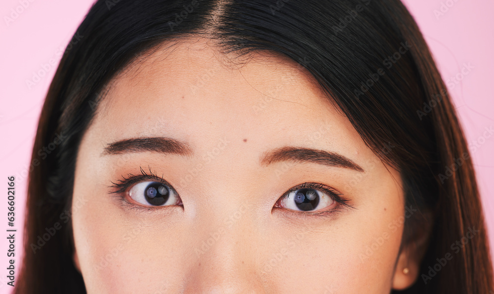 Closeup, eyes and portrait of an Asian woman on a pink background for makeup or microblading. Face, 