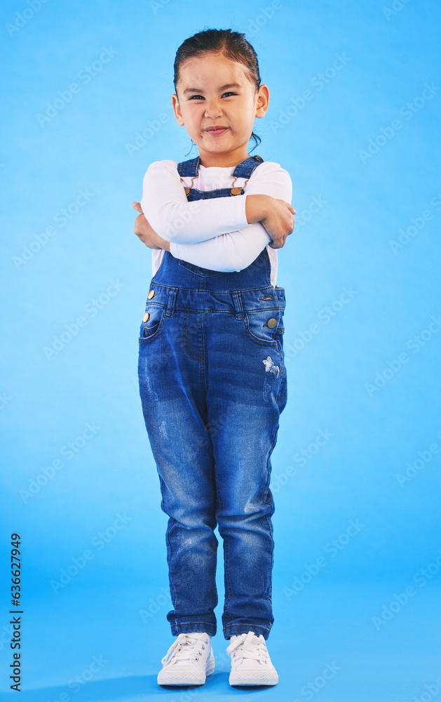 Frustrated, child and arms crossed with tantrum in studio with mockup space. Kid, young girl and ang