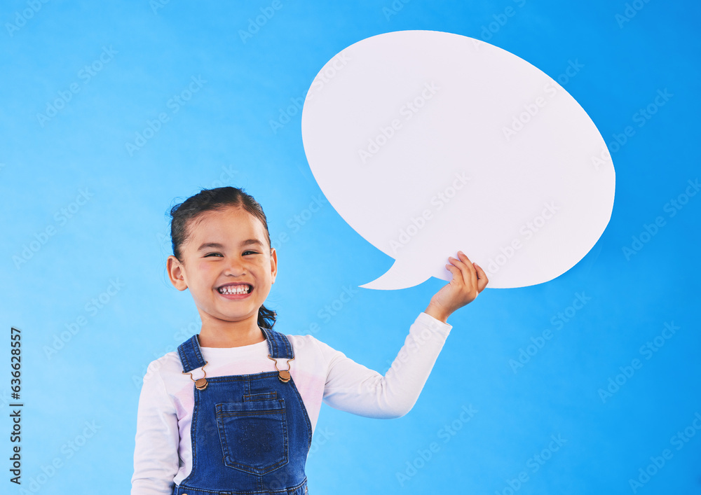 Girl child, speech bubble and studio portrait for smile, mockup space and excited by blue background