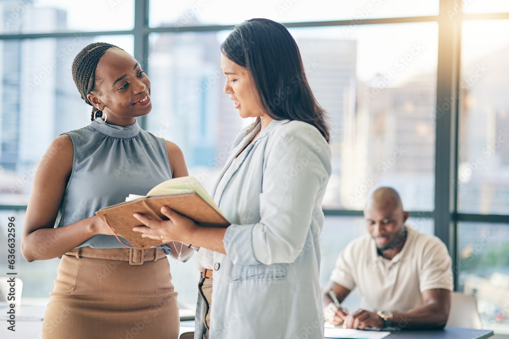 Collaboration, diversity and notebook with business woman planning their schedule or calendar in the