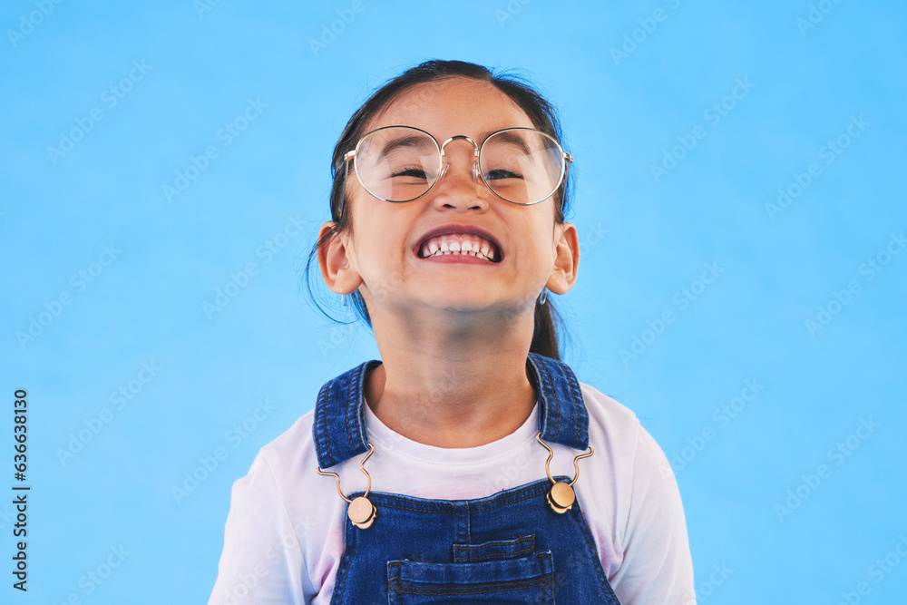 Glasses, student smile and Asian child in portrait in studio isolated on a blue background mockup sp