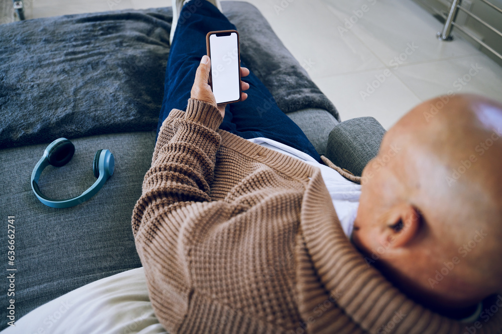 Phone screen, mockup and a man on a home sofa for internet advertising with social media or a websit