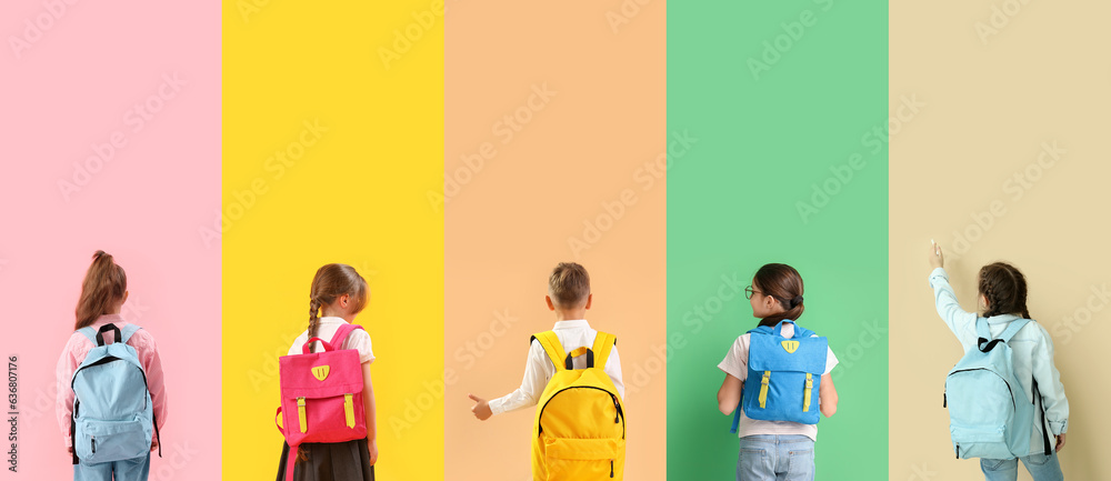 Group of little school children with backpacks on color background, top view