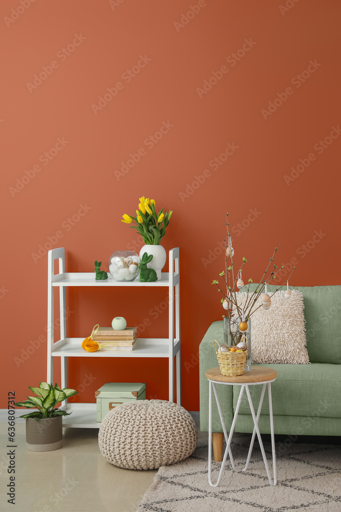 Interior of stylish living room with sofa, rack and Easter decor