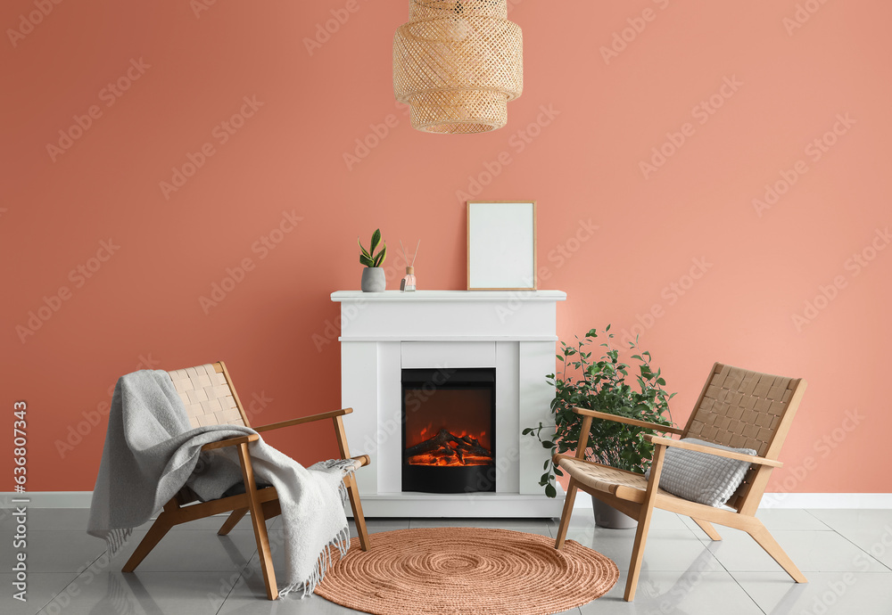 White fireplace with armchairs and rug near color wall in living room