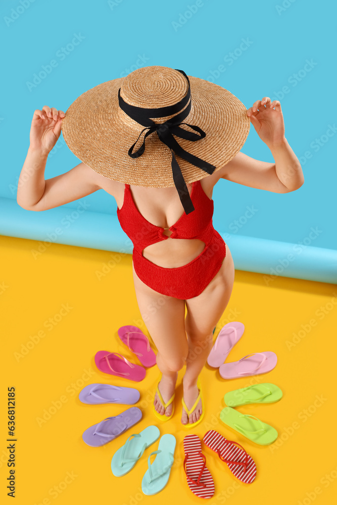 Beautiful young woman in swimsuit with different colorful flip flops on color background