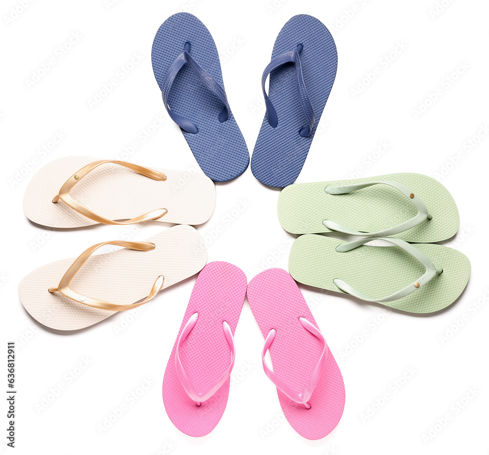 Frame made of colorful pairs of female flip flops on white background