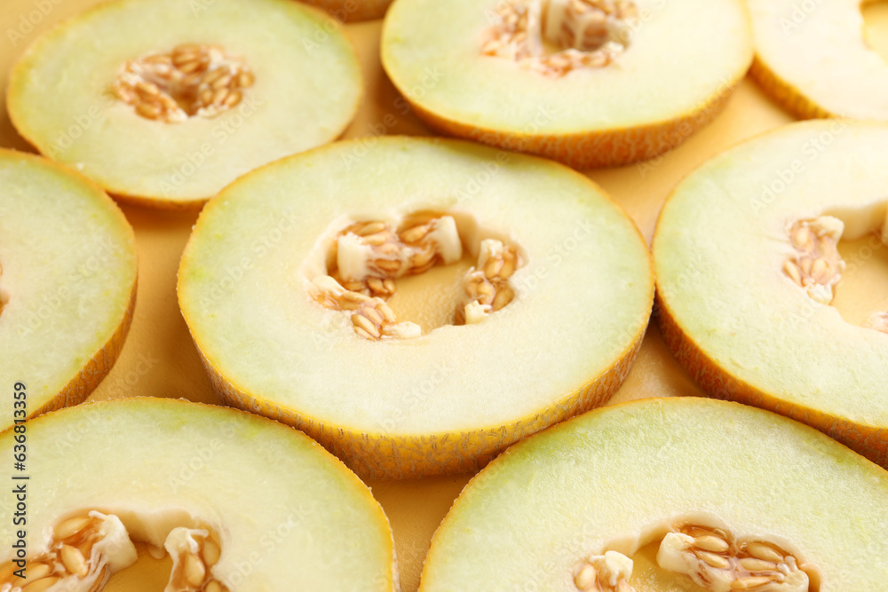 Slices of sweet melon on yellow background