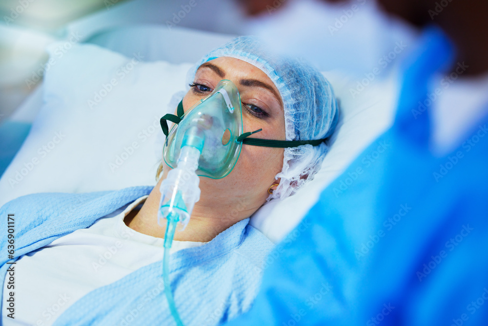 Hospital, anesthesia and woman with oxygen mask in surgery for medical service, operation and proced