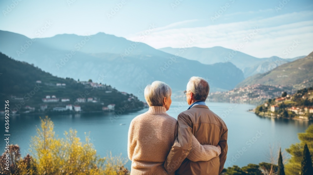 Senior couple, moutains and lake view background