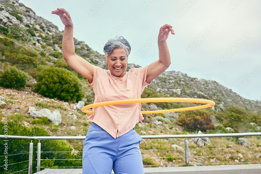 Senior woman, hoop and fitness outdoor with smile, training and playful on balcony, mountains and he