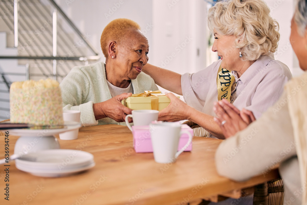 Senior friends, birthday cake and women celebration at a home with a present and gift with people. S