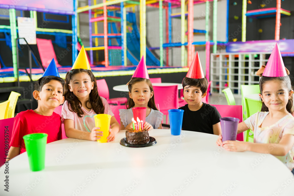 Group of kids having fun in a birthday party with friends