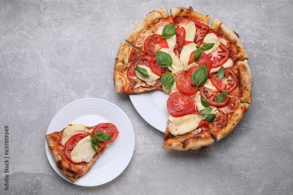 Delicious Caprese pizza on grey table, flat lay