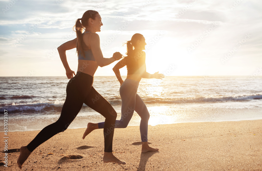 Cheerful active pretty young caucasian women enjoy morning cardio workout, jogging on sea beach, ful