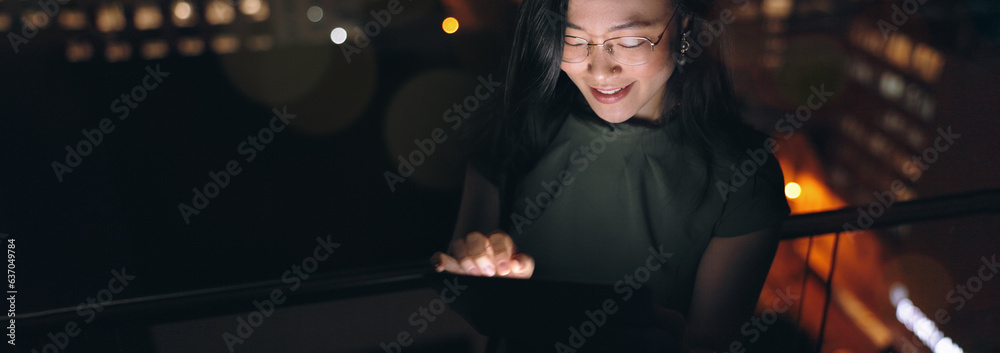 Woman, digital tablet and rooftop at night in city for social media, research and networking on urba