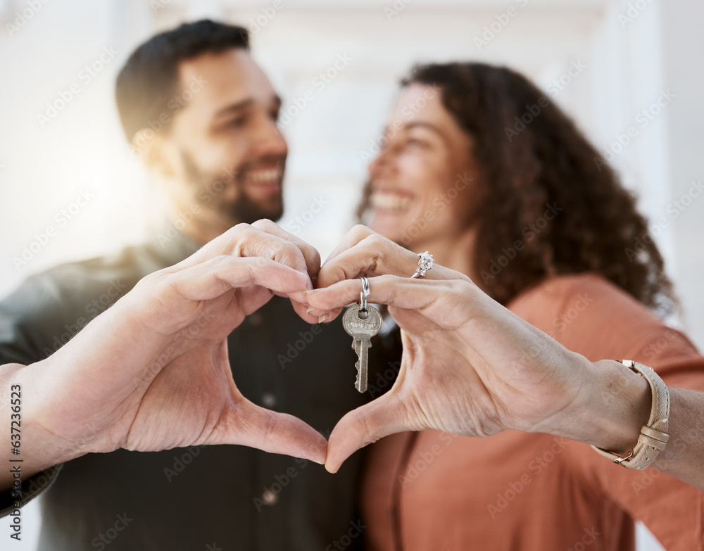 Heart hands, keys and couple hug for real estate, success or mortgage loan in new home together. Lov