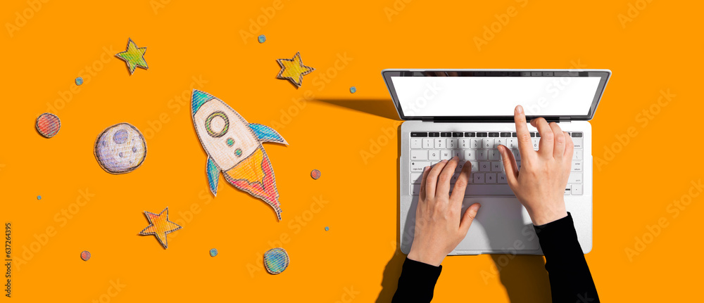 Space exploration theme with a rocket and a laptop