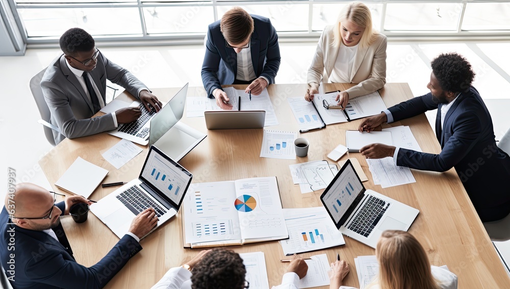 Top view of a group of multiethnic businesspeople working together in an office