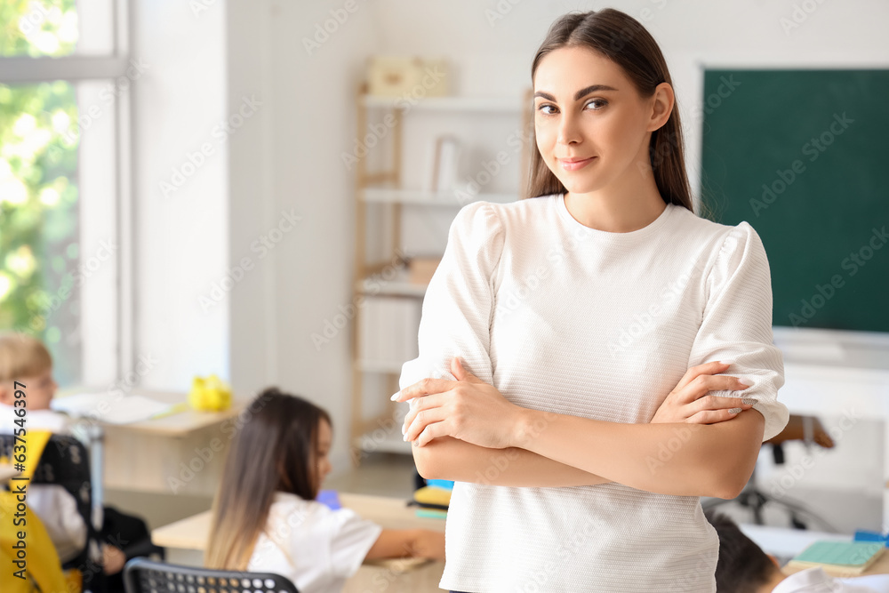 Young female teacher in classroom