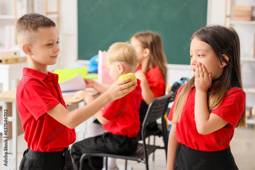 Little children in classroom at school