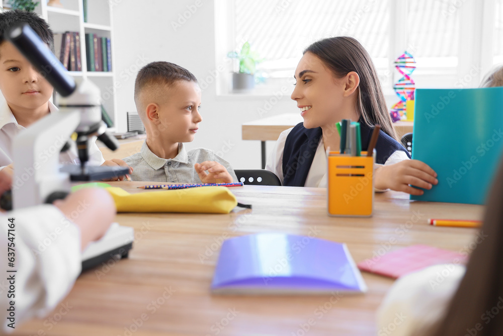 Female teacher conducting lesson in classroom