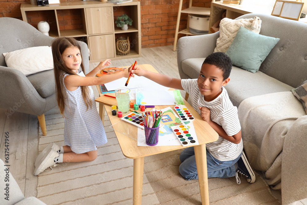 Cute little children drawing at home