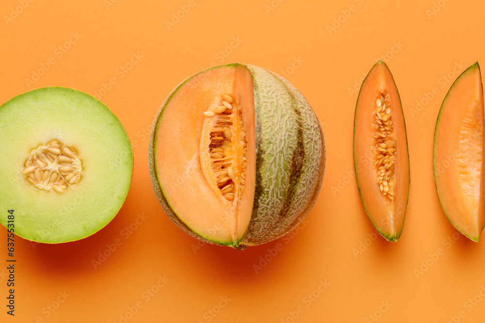 Tasty ripe melons on orange background