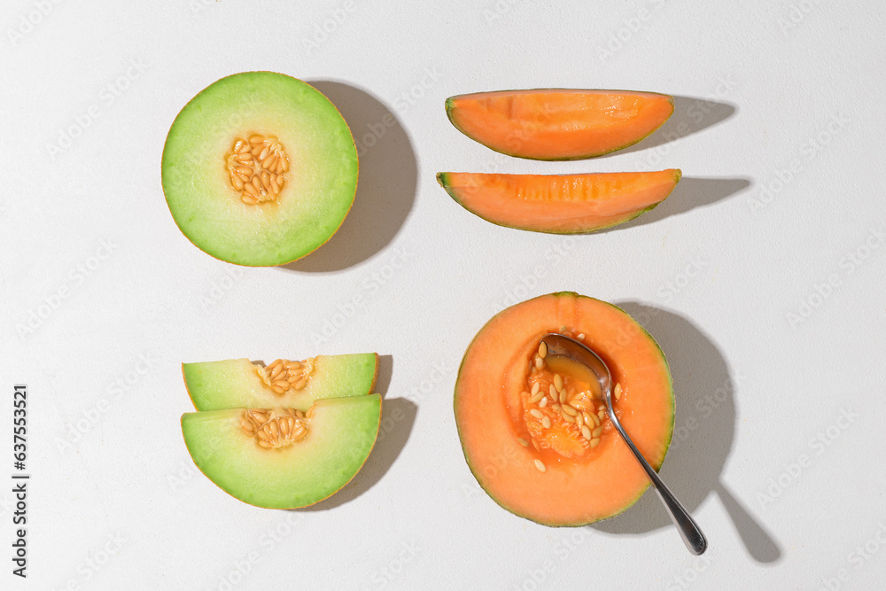 Ripe cut melons on white background