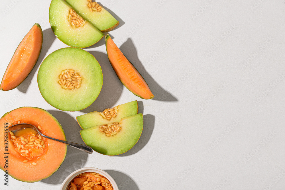 Ripe cut melons on white background