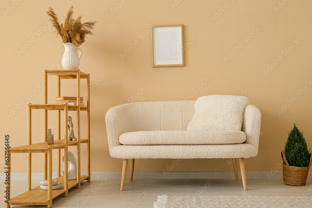 Interior of stylish living room with white sofa and shelving unit