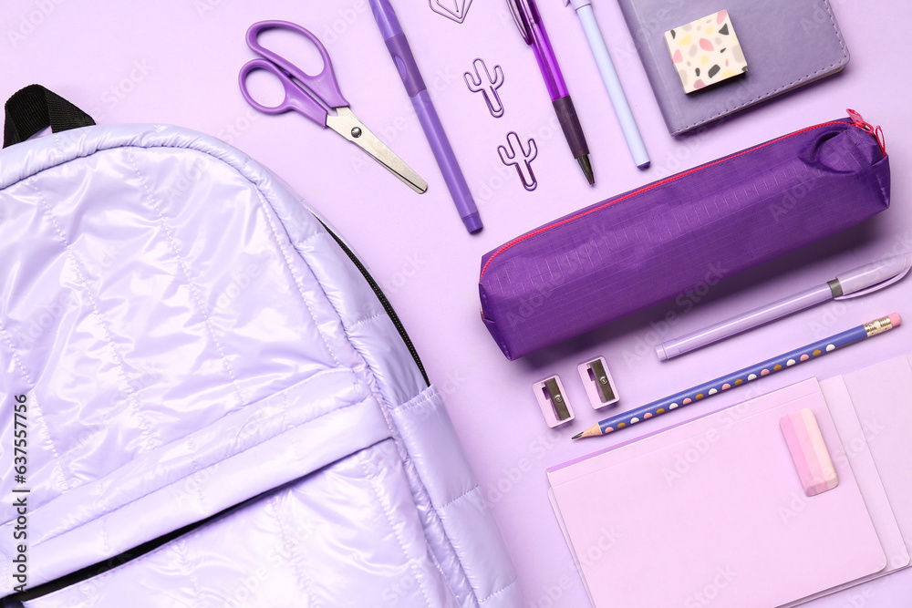 Stylish school backpack with pencil case and different stationery supplies on lilac background