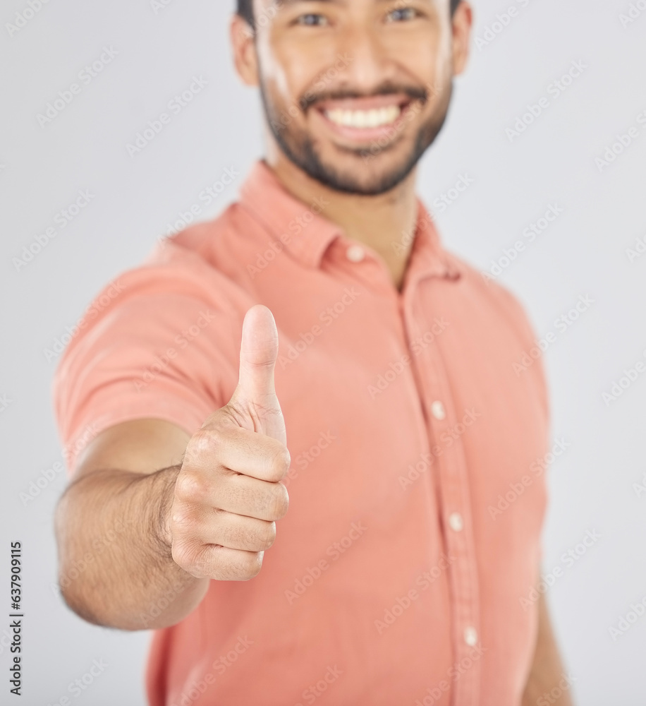 Happy asian man, portrait and thumbs up in success, winning or good job against a white studio backg