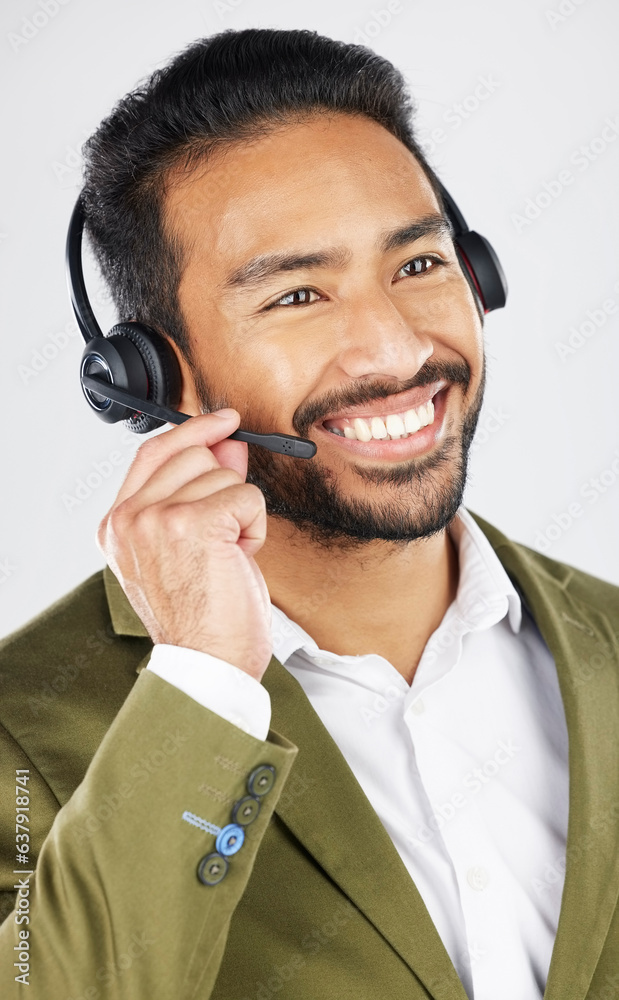 Happy asian man, call center and headphones in customer service, support or telemarketing against a 