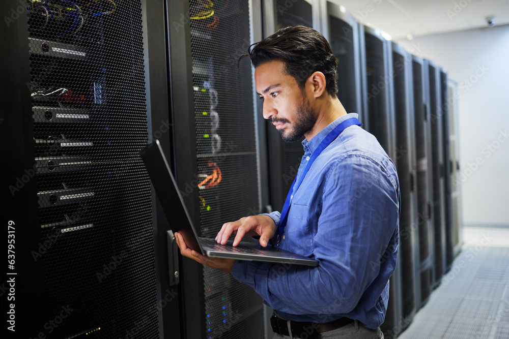 Programming, data center and a man with a laptop for maintenance, cyber security and internet check.