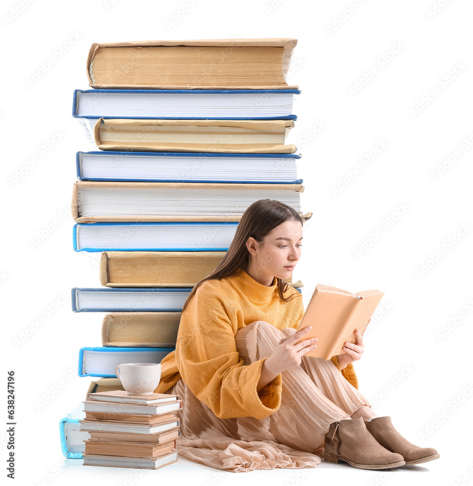 Beautiful woman in yellow sweater reading book on white background