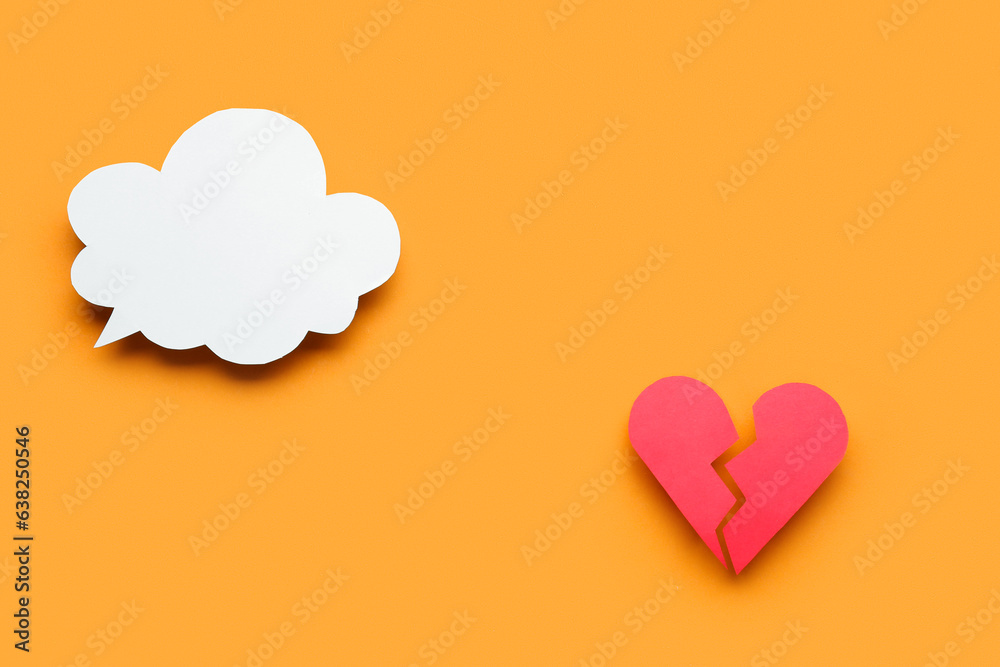 Blank speech bubble and broken heart on orange background