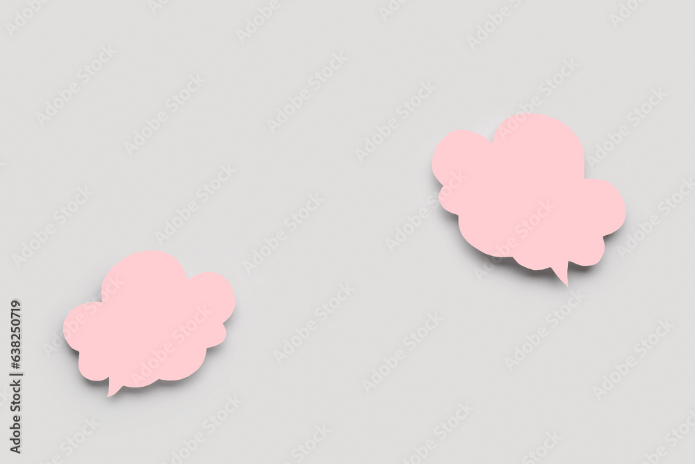 Blank speech bubbles on grey background