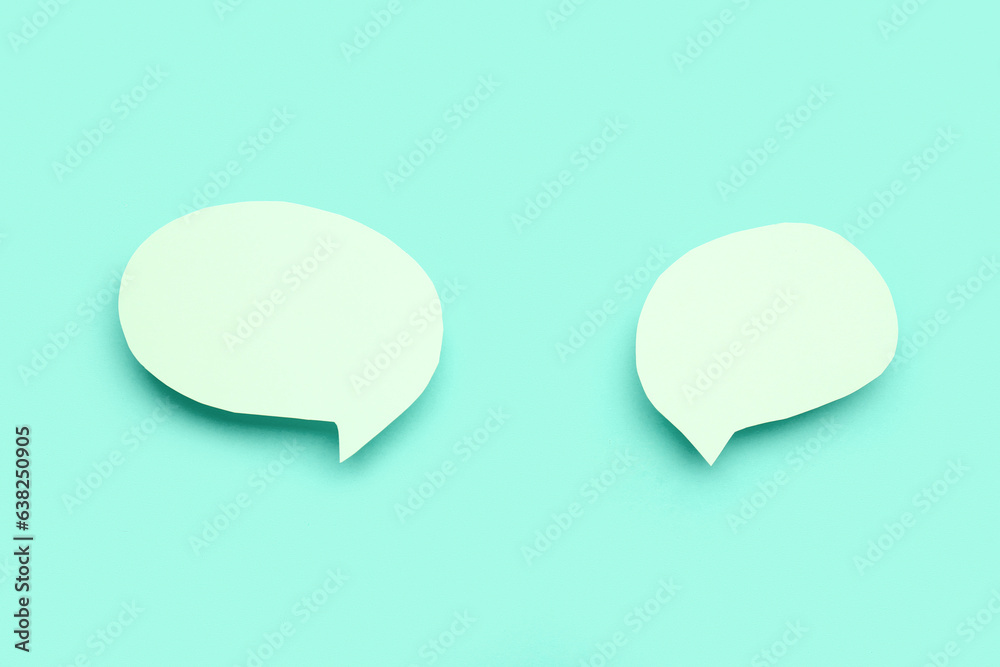 Blank speech bubbles on turquoise background